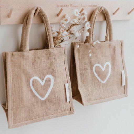 small jute shoppers with white heart