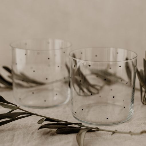 2 drinking glasses with black dots