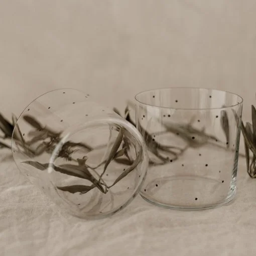 2 drinking glasses with black dots