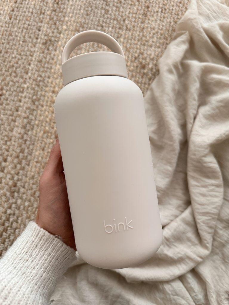 Beige glass water bottle