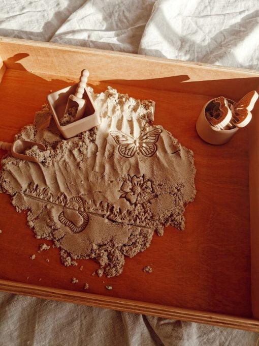 wooden play area with magic sand