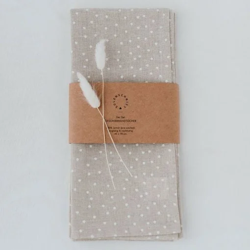 linen tea towel with dots in packaging